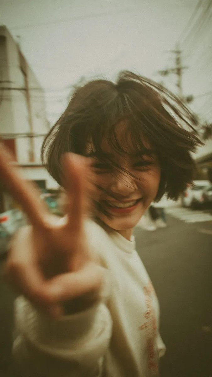 Nostalgic Y2K Peace Sign Portrait in Japan