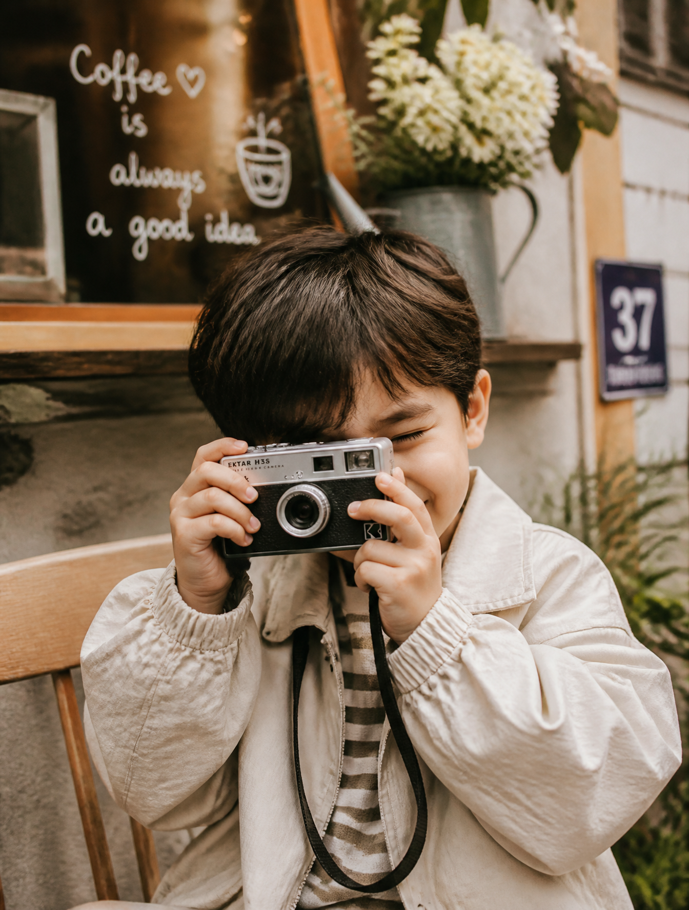 Young Photographer with Vintage Mini Camera