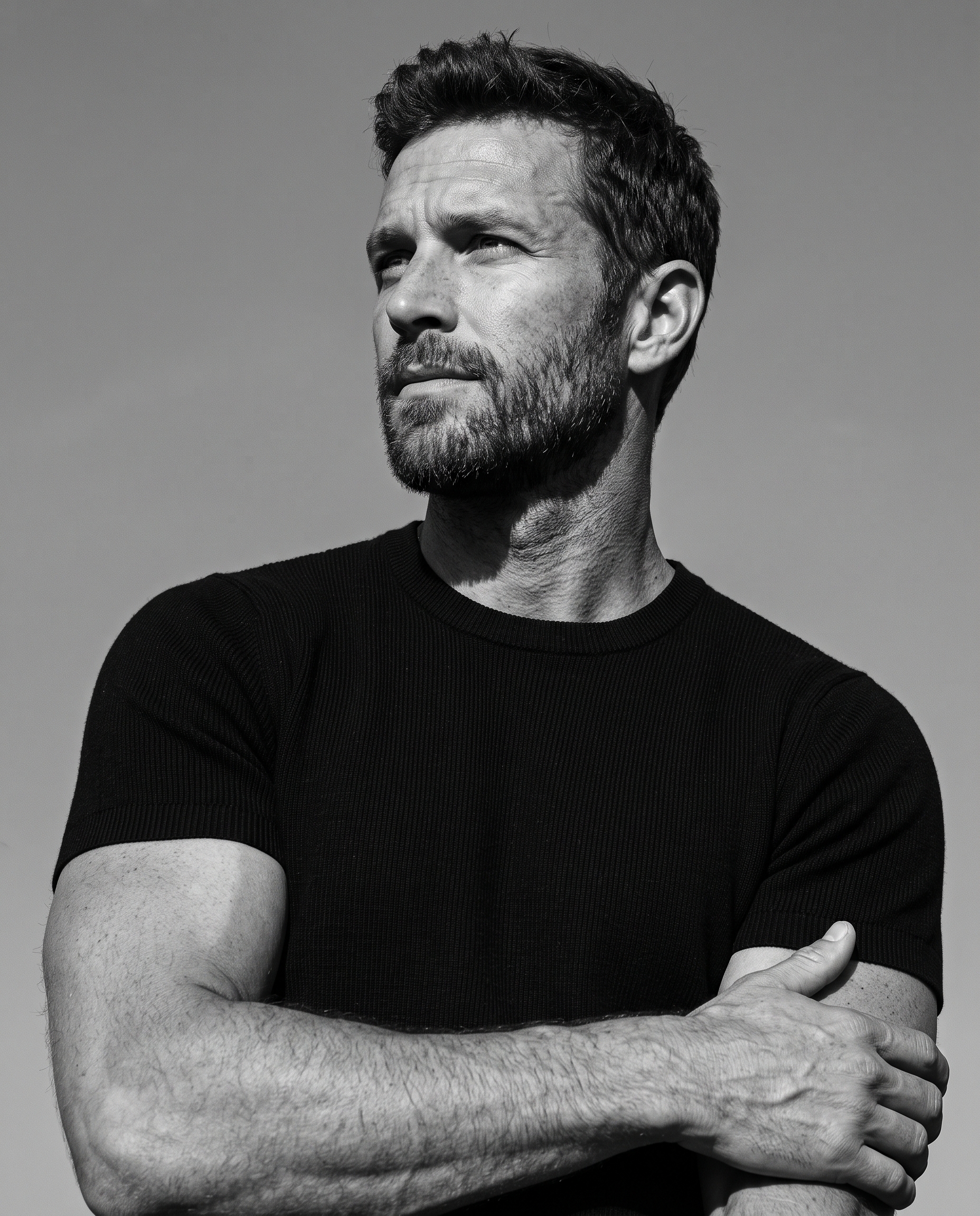 Ultra-realistic black-and-white editorial portrait, low-a...