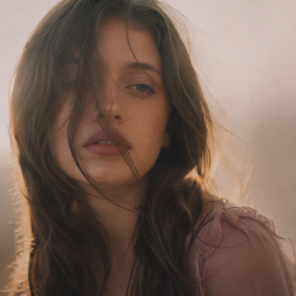 Portrait shot on 85mm f/1.4, square crop close-up of refe...
