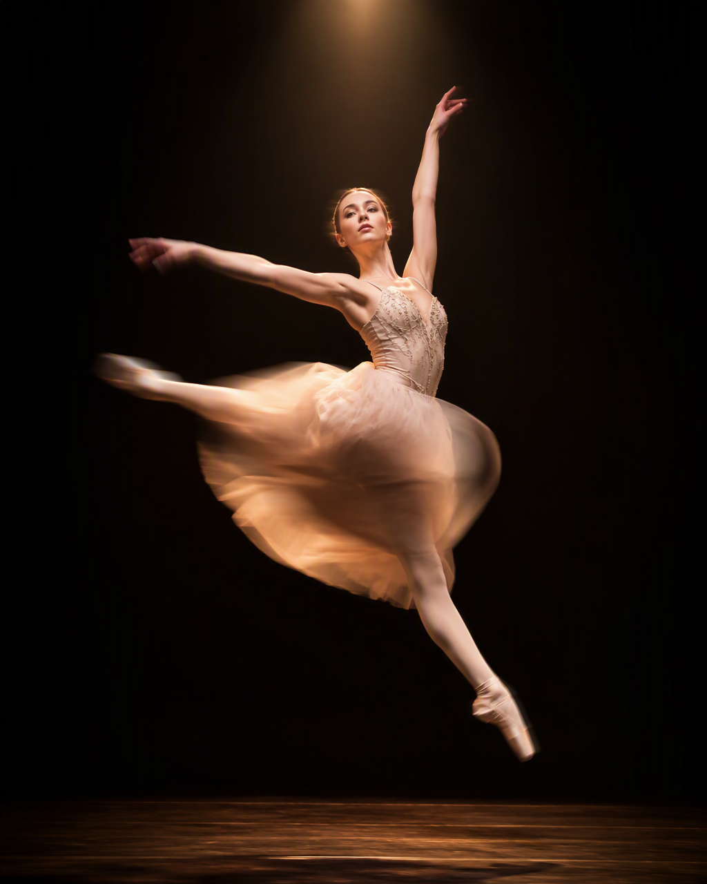SUBJECT: a young ballet dancer mid-leap on a dark stage, ...