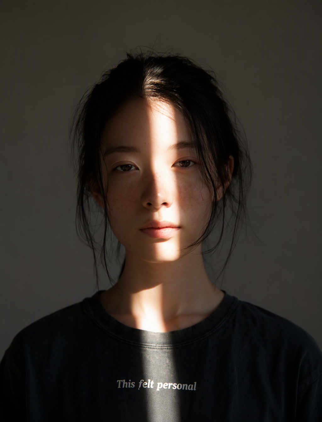 a starkly lit portrait of an asian woman with black hair ...