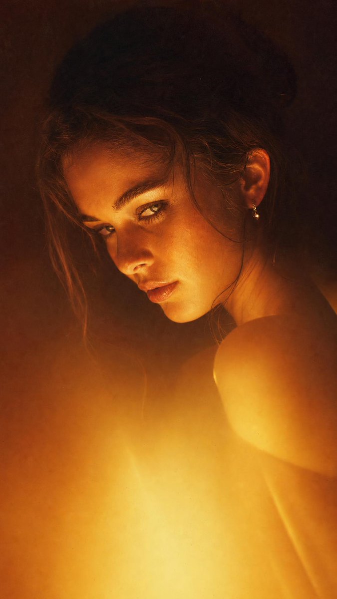 Dramatic close-up portrait with warm colored lighting, a ... - alternate