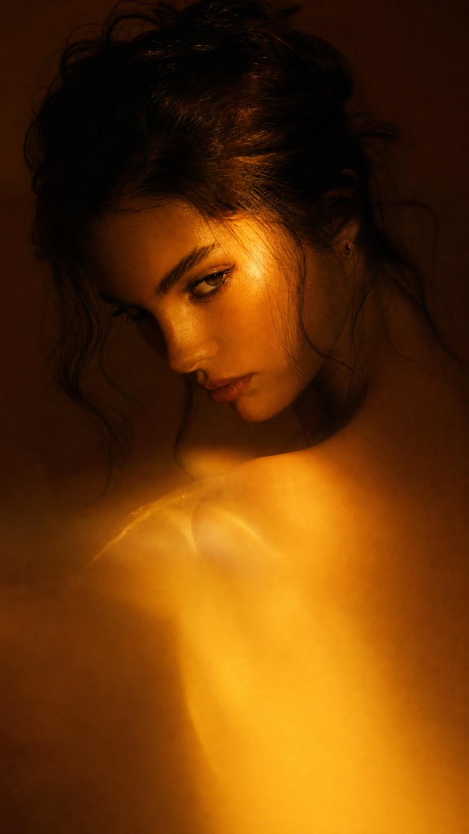 Dramatic close-up portrait with warm colored lighting, a ... - alternate