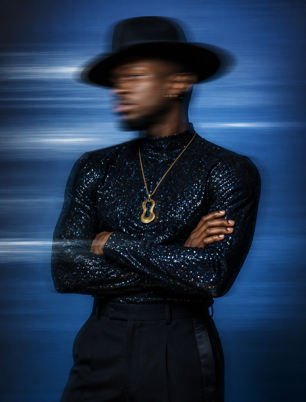 A medium shot captures a Black male model from the waist ...