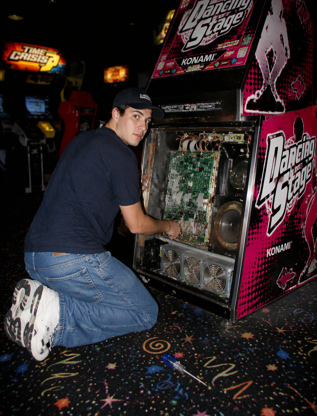 A vintage, late 90s amateur flash photograph of a young m...