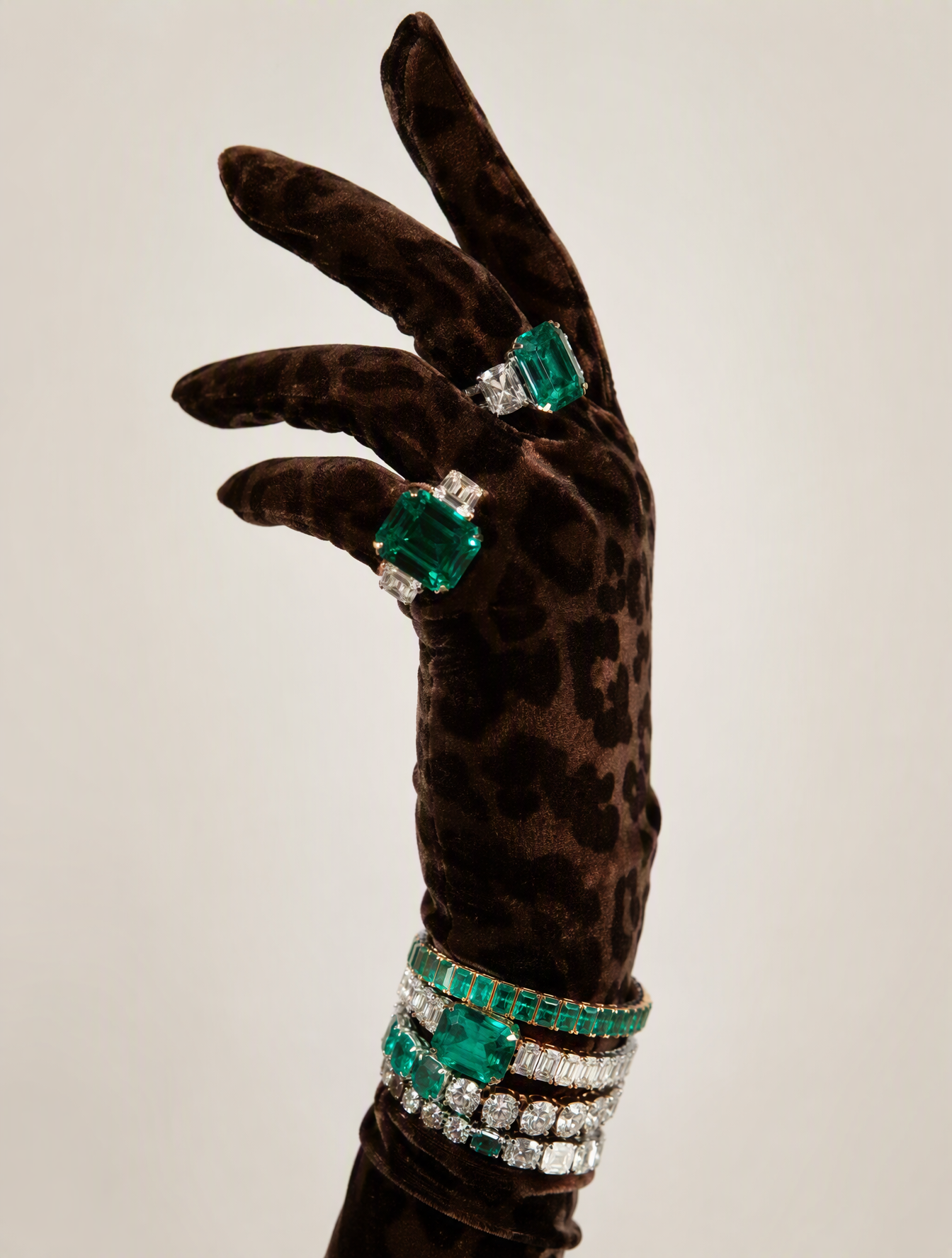 Luxury studio photograph of a feminine hand wearing a dee...