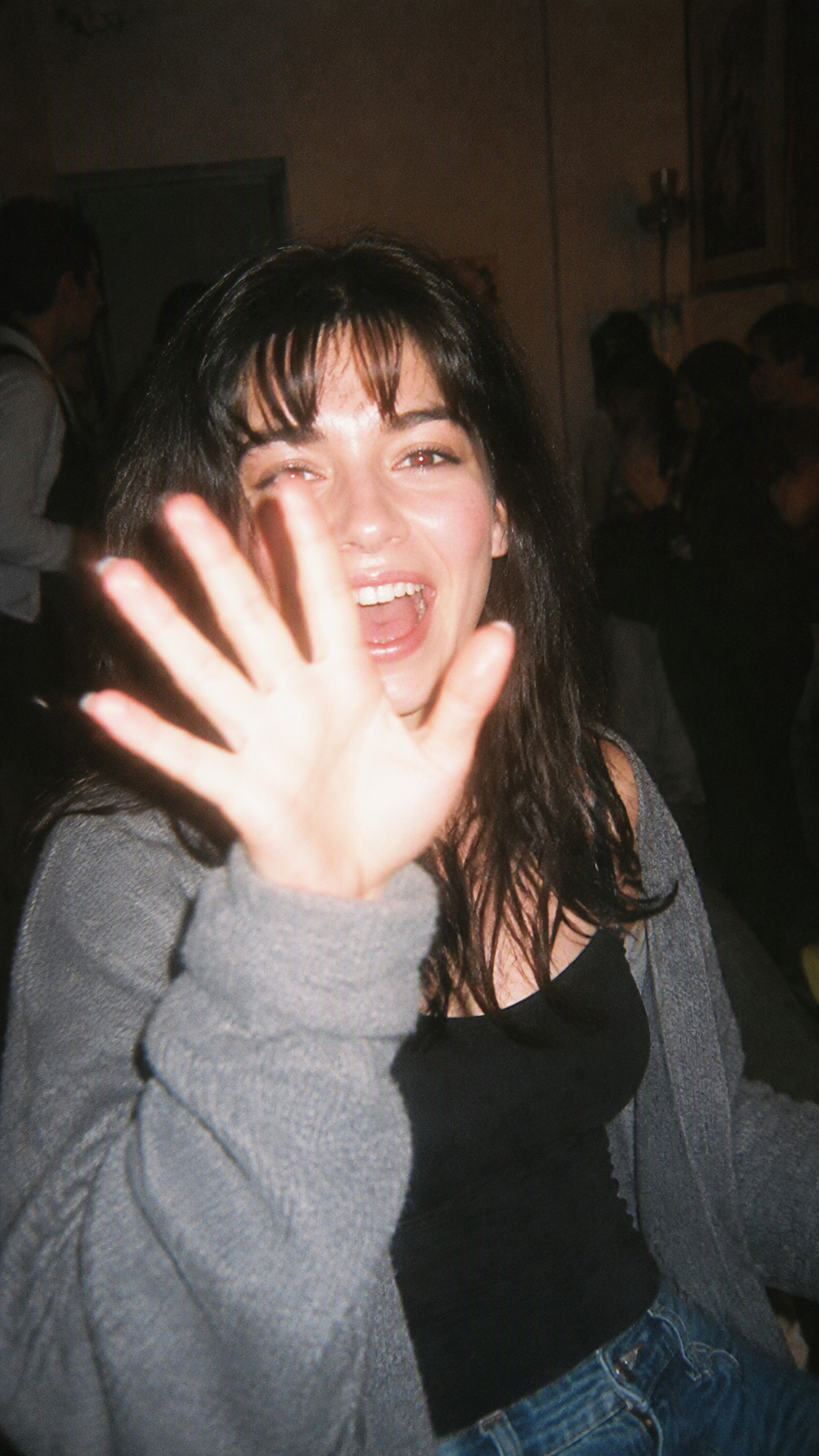 Raw disposable-camera photograph of a clearly adult woman...