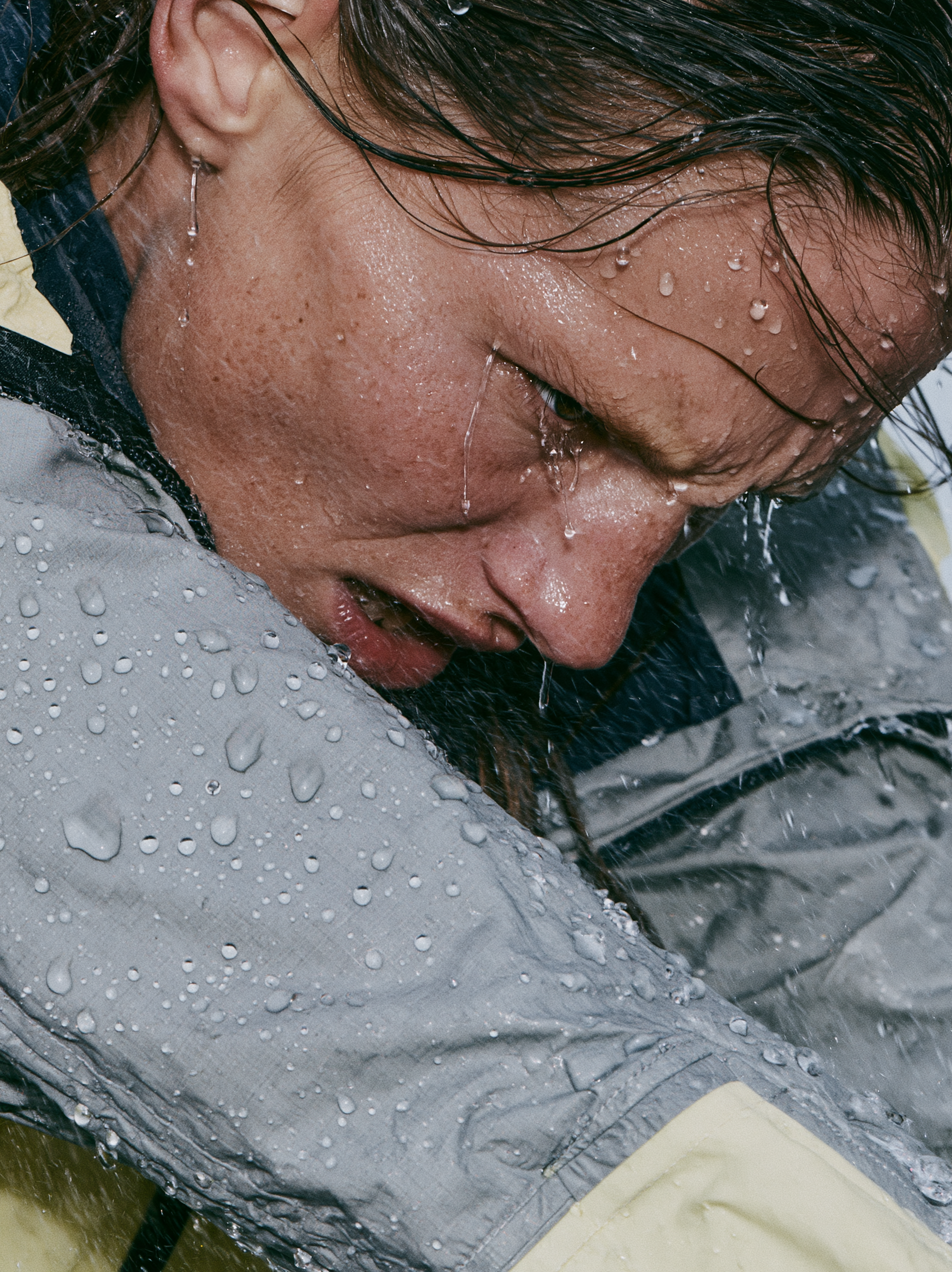 Heavy natural rainfall surrounds the model, with fine rai...