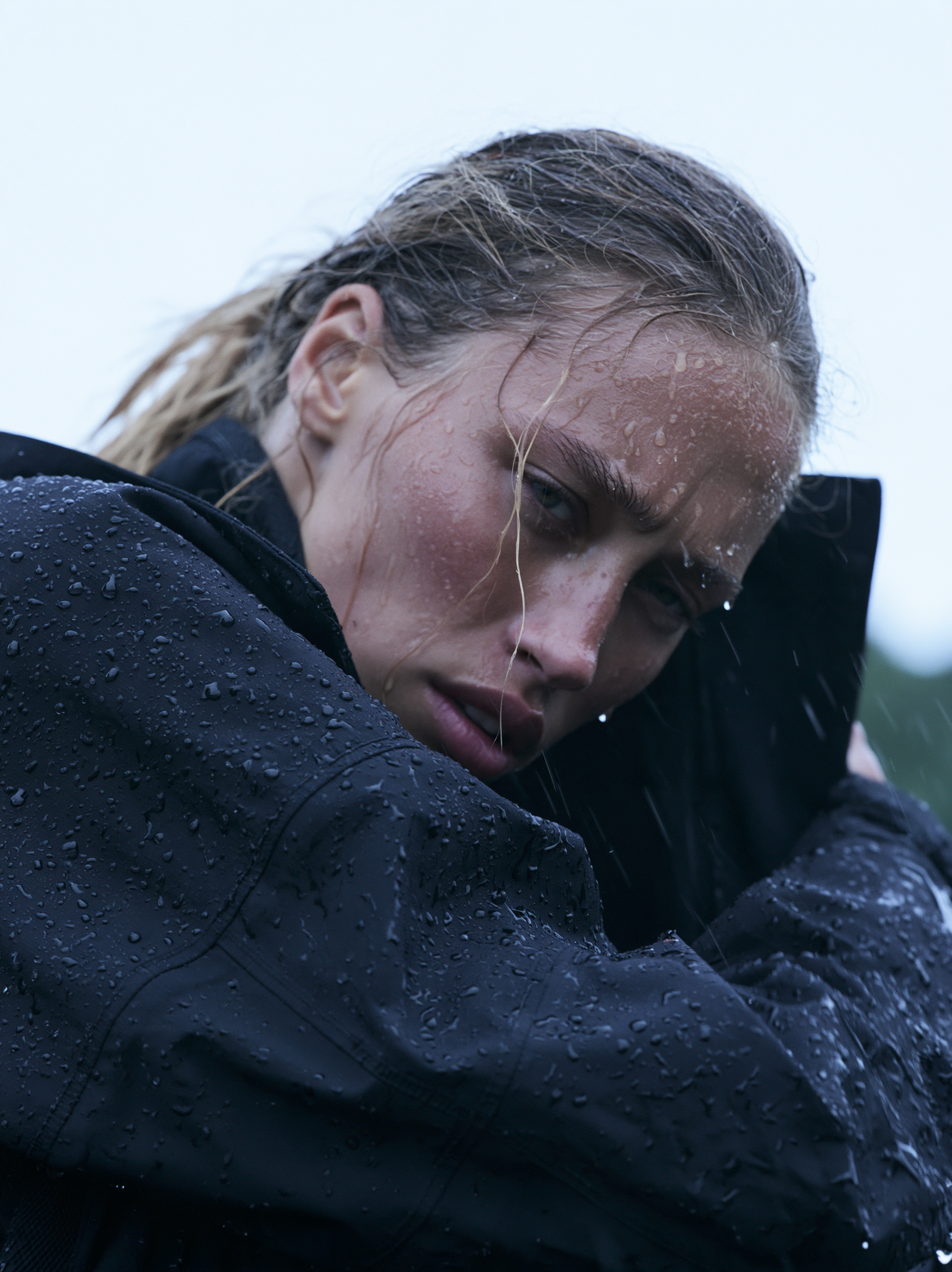 Heavy natural rainfall surrounds the model, with fine rai... - alternate