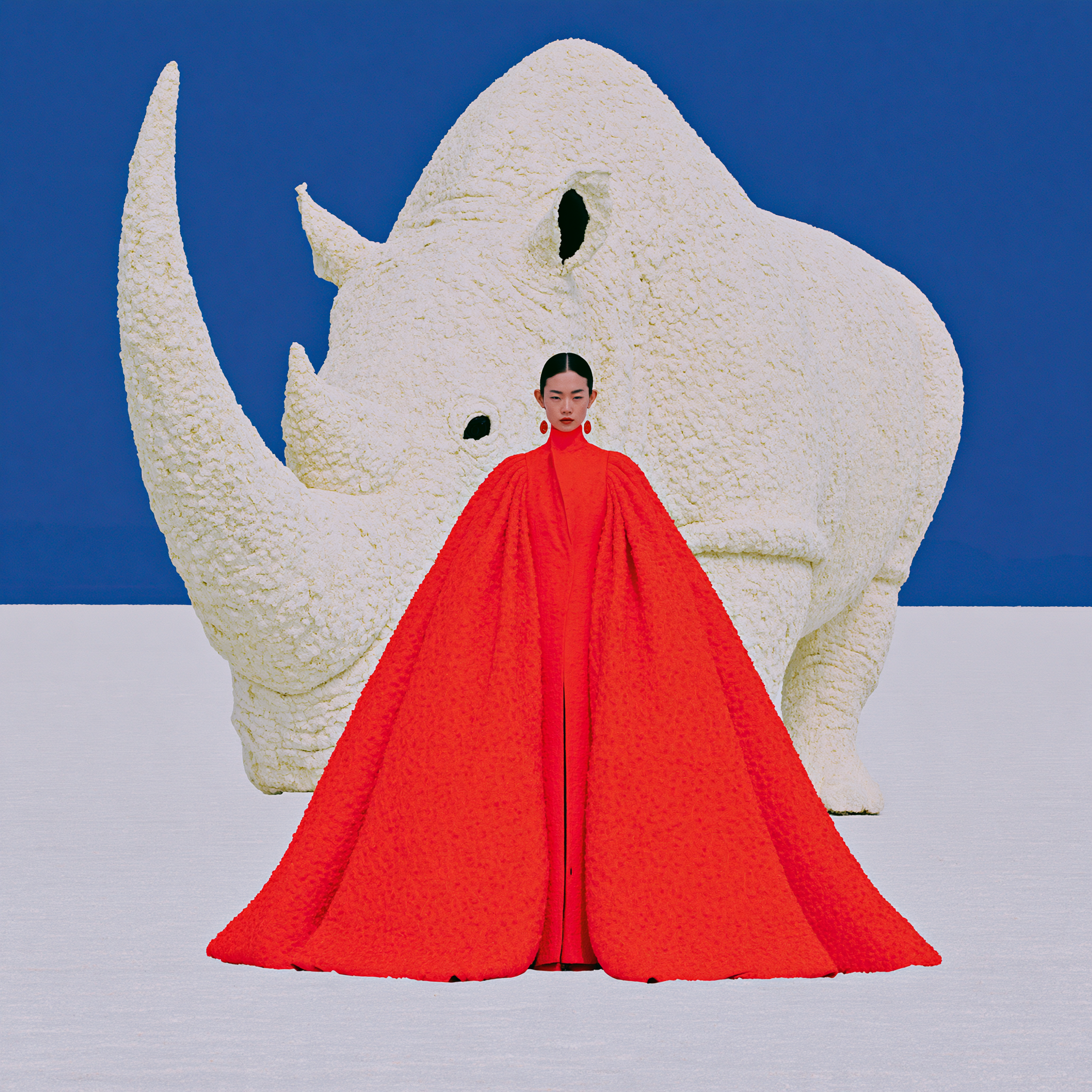 a surreal high-fashion editorial photograph, a colossal w... - alternate