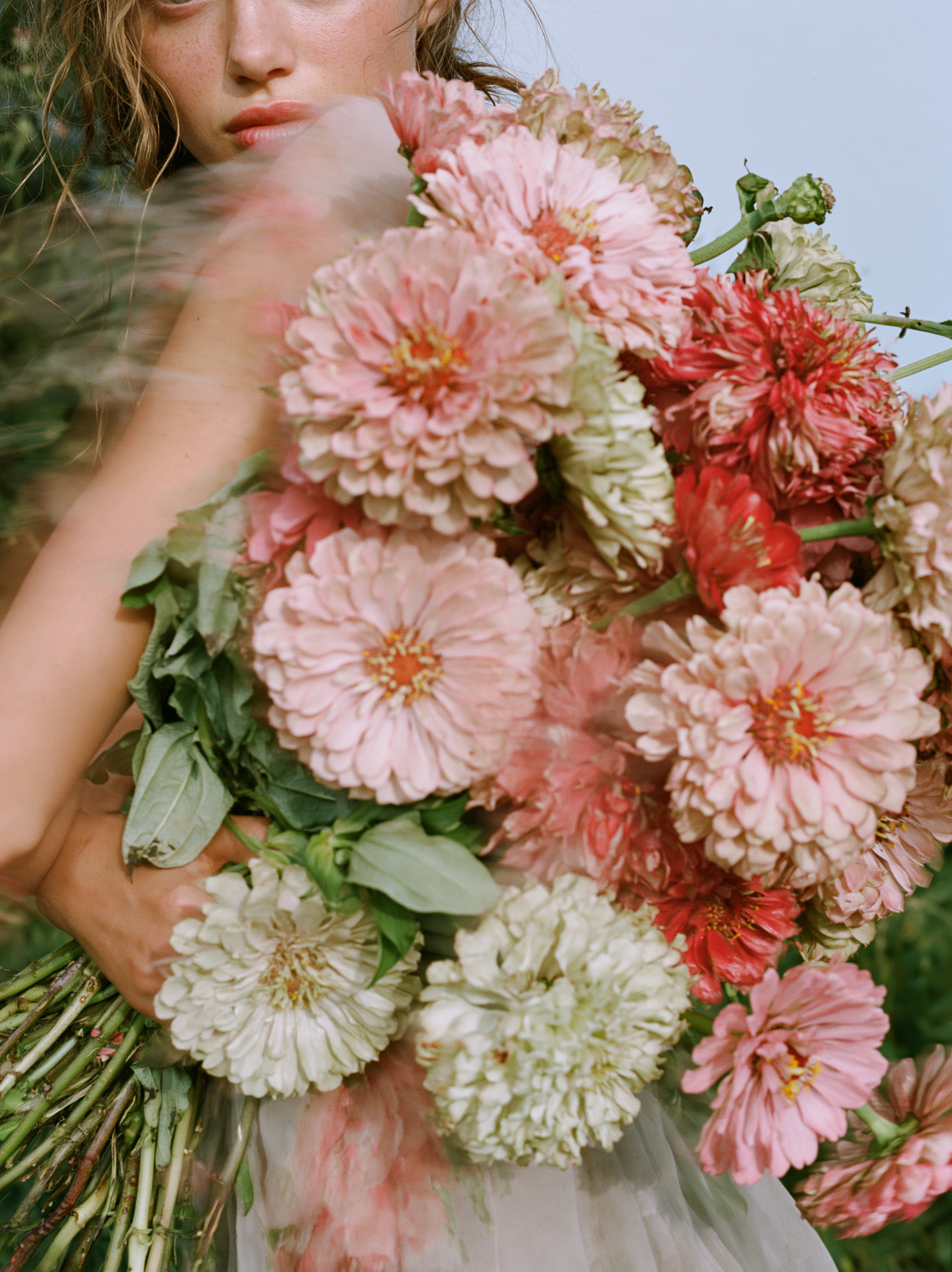 soft fashion photograph of a young woman quietly holding ...