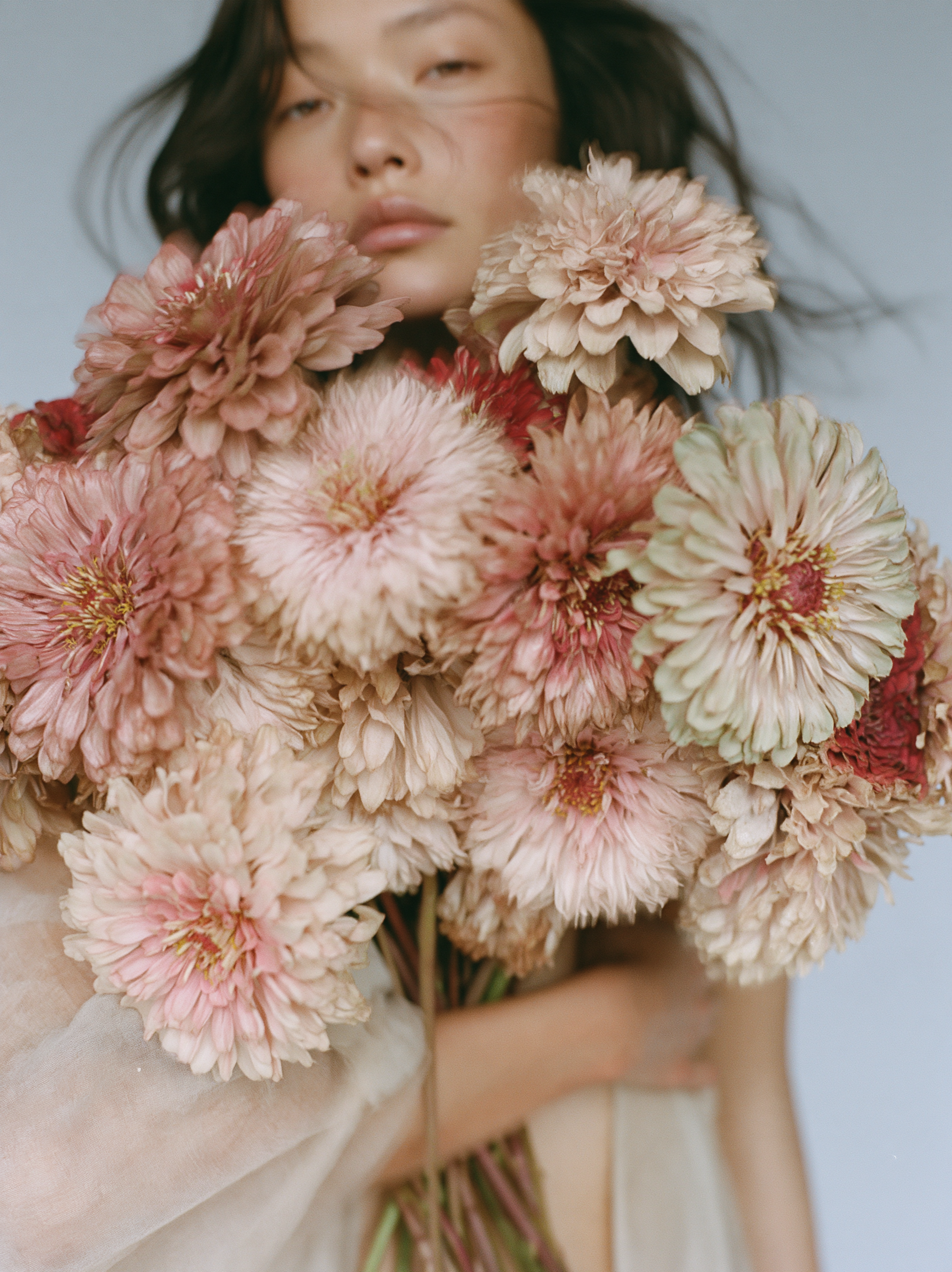 soft fashion photograph of a young woman quietly holding ... - alternate