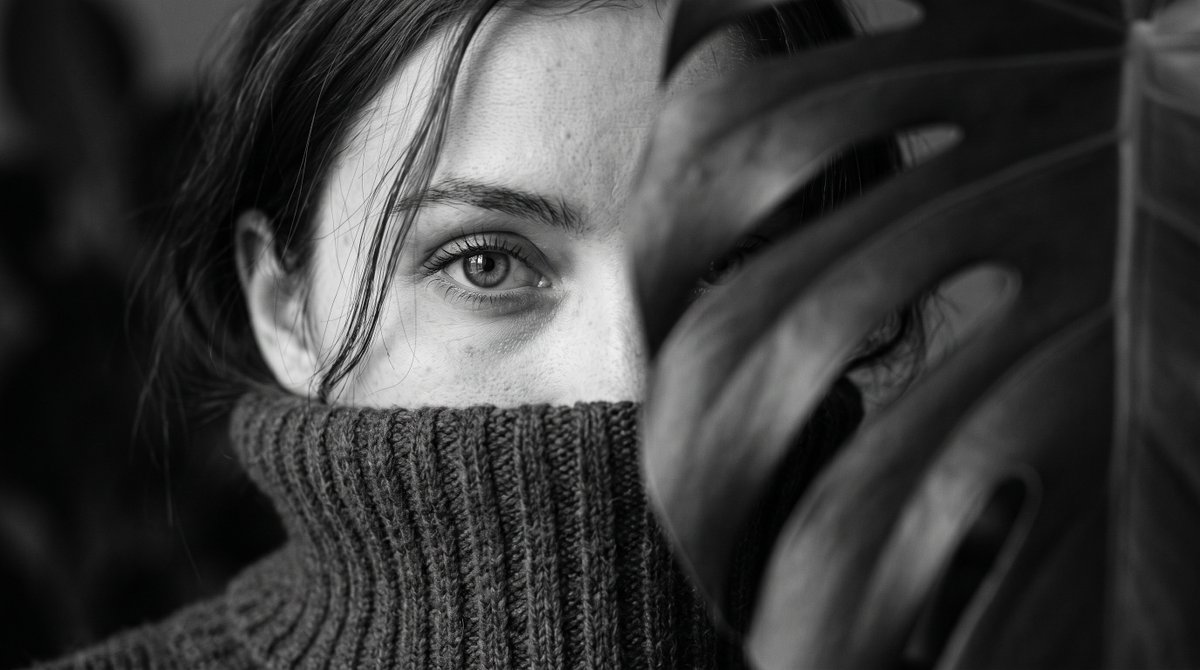 Intimate black and white editorial close up of a young wo...