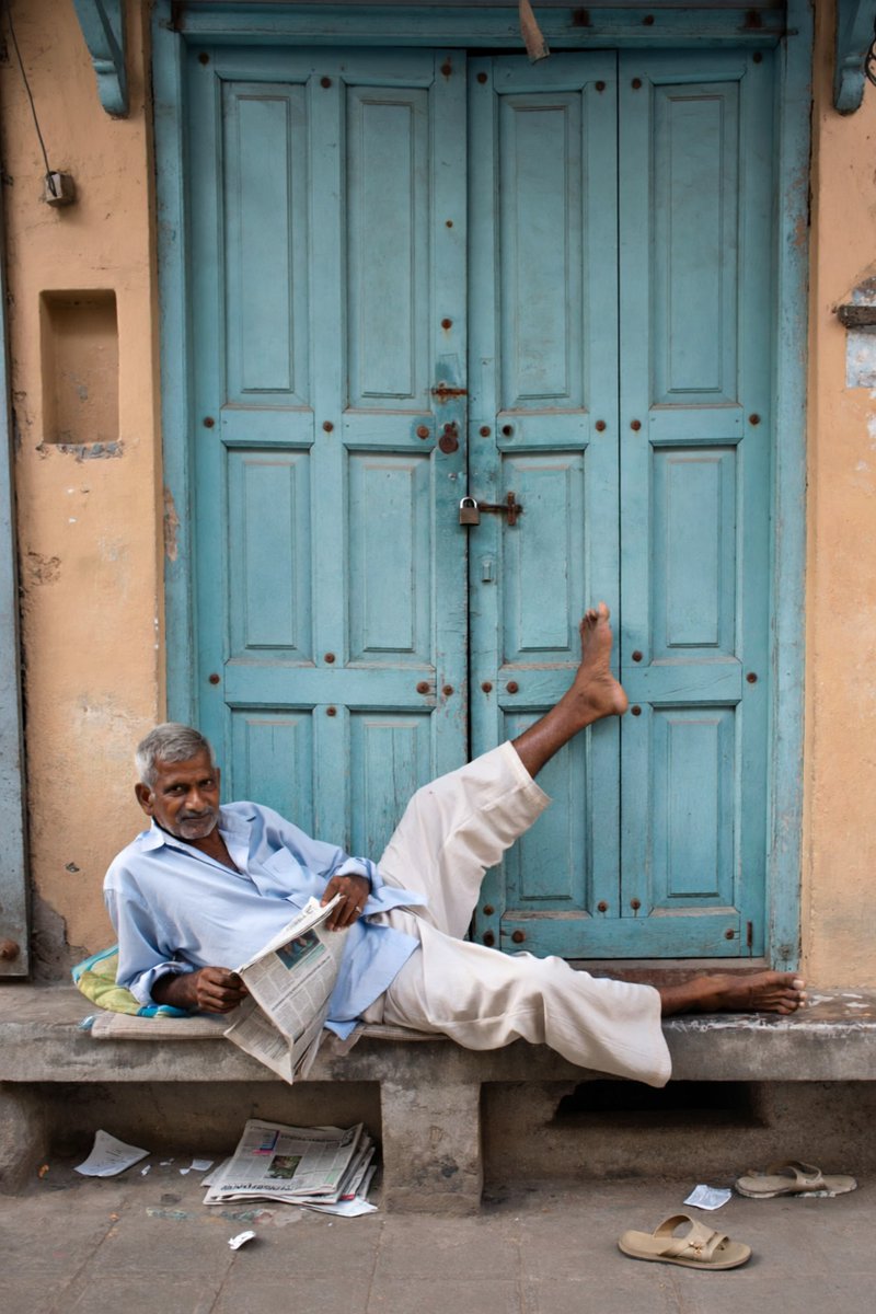 Create a photorealistic documentary street photograph of ...